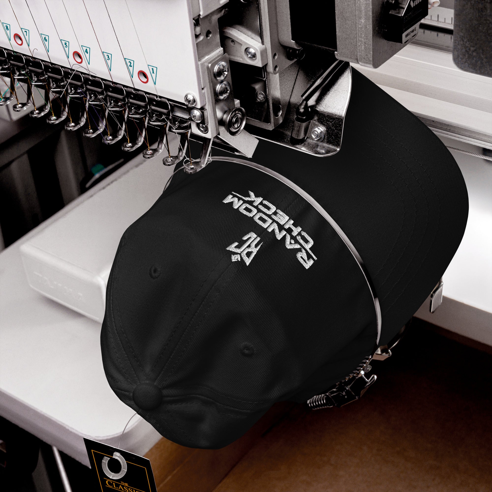 Black Classic Dad Hat front view showing Random Check logo embroidery
