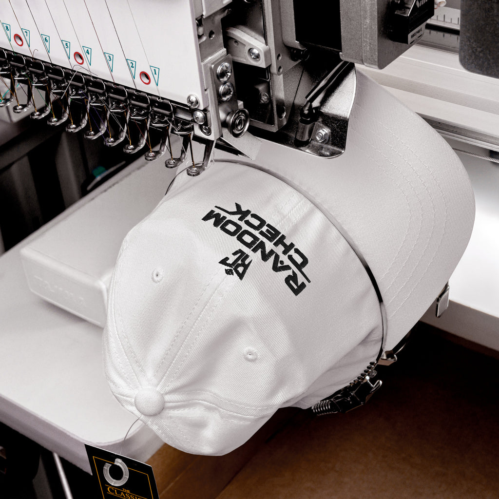 White Classic Dad Hat front view showing Random Check logo embroidery