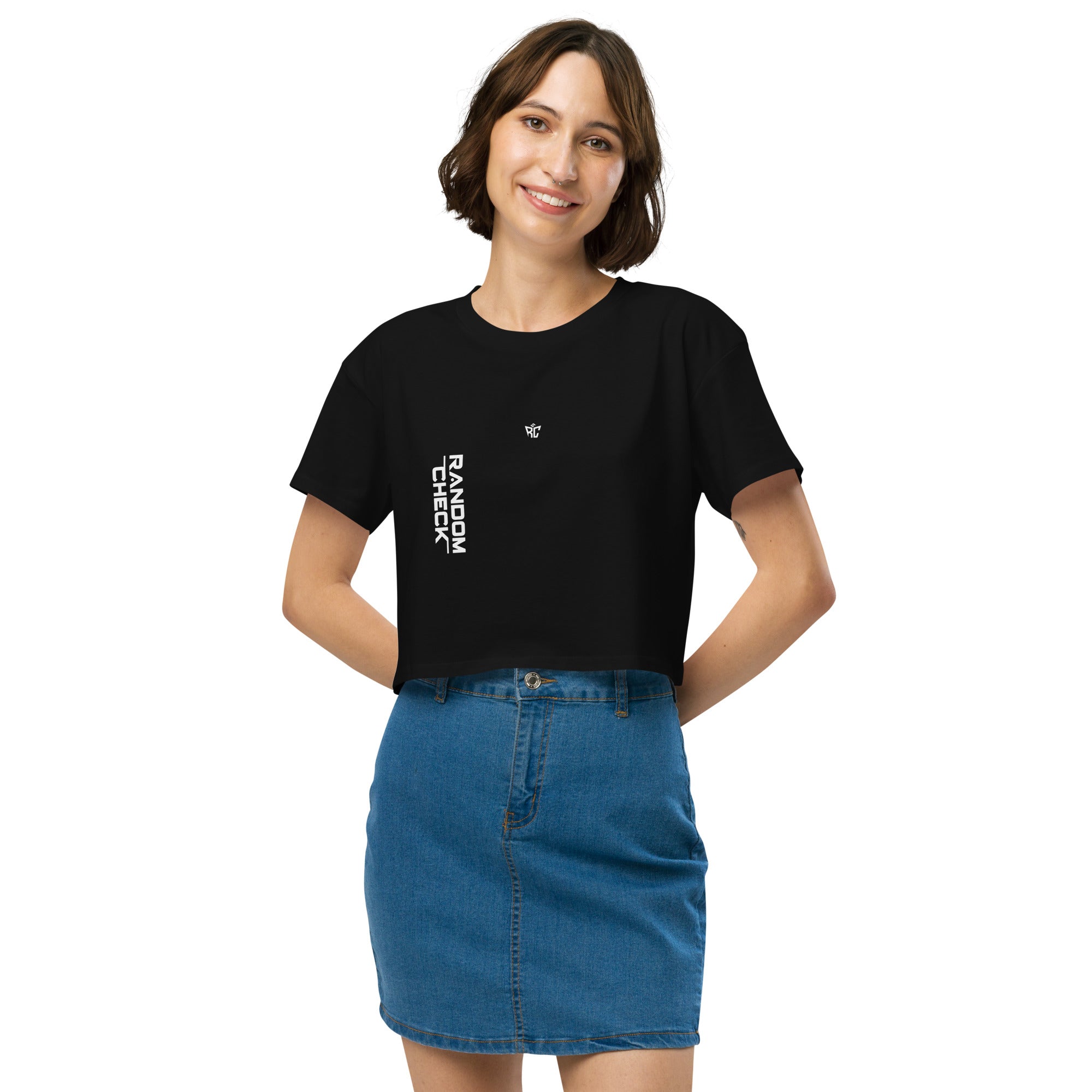 Woman wearing a black t-shirt with text and a blue denim skirt on a white background