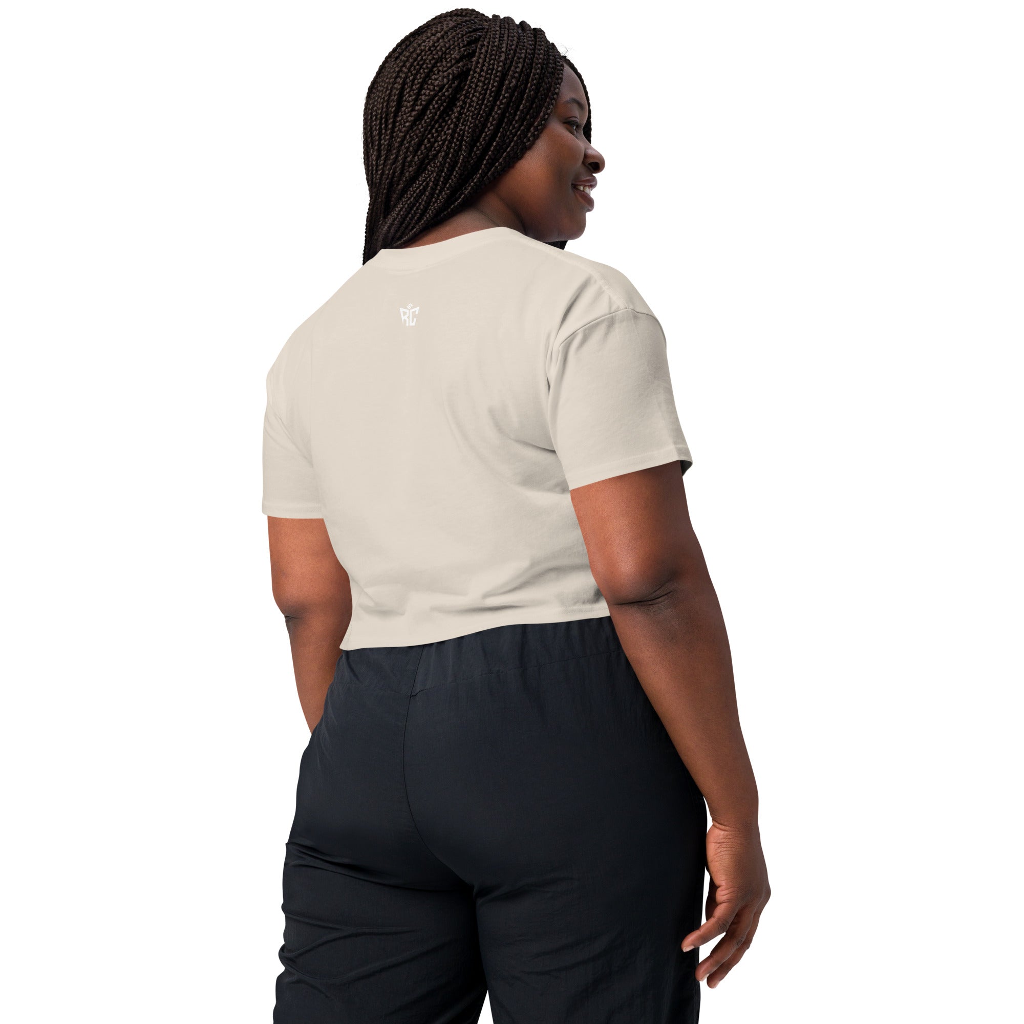 Woman wearing a white t-shirt and black pants on a white background
